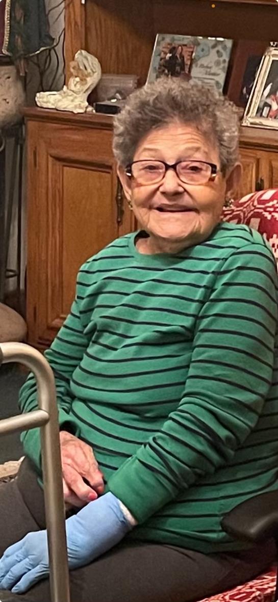 An old woman in a green shirt