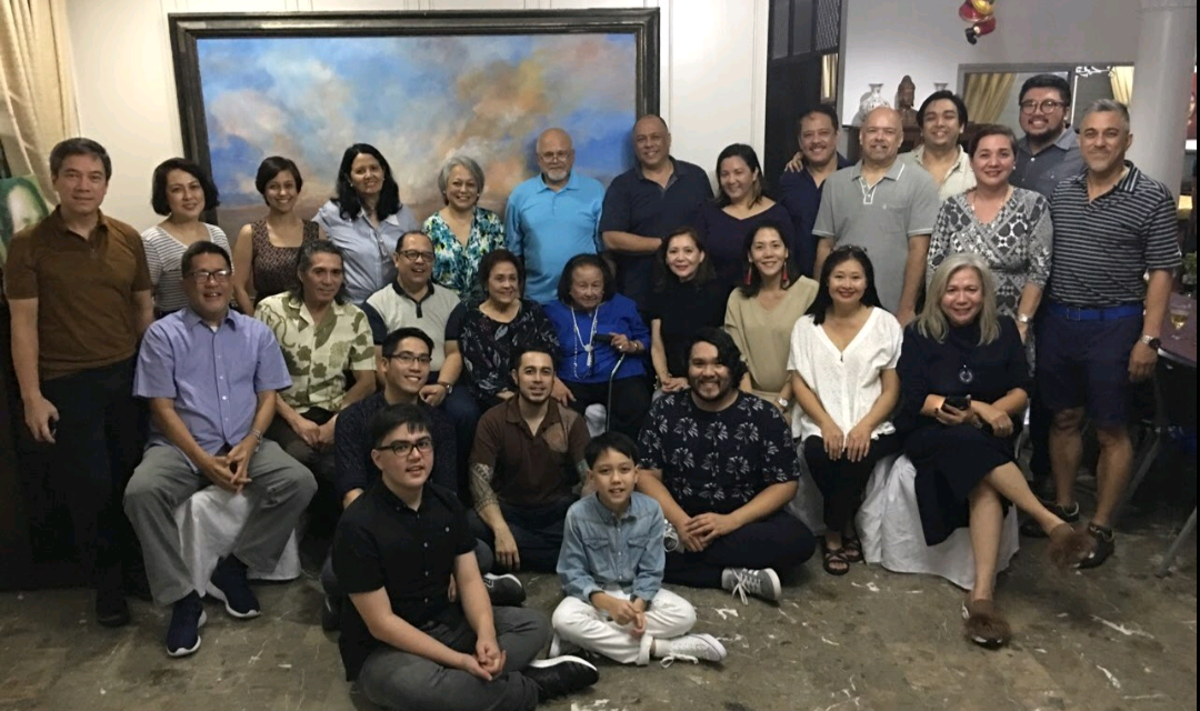 A joyful gathering of friends and family taking place in a welcoming indoor setting.