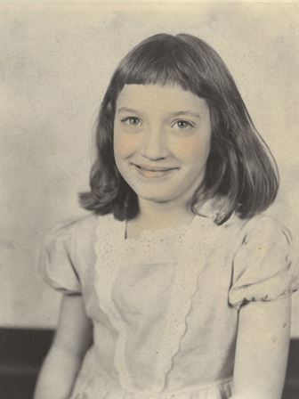 A girl smiling for a picture