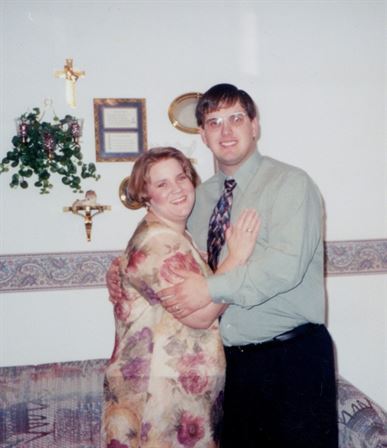 A man and woman posing for a picture