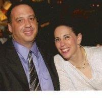 Friends enjoy each other’s company, smiling warmly at a gathering in an upscale location.