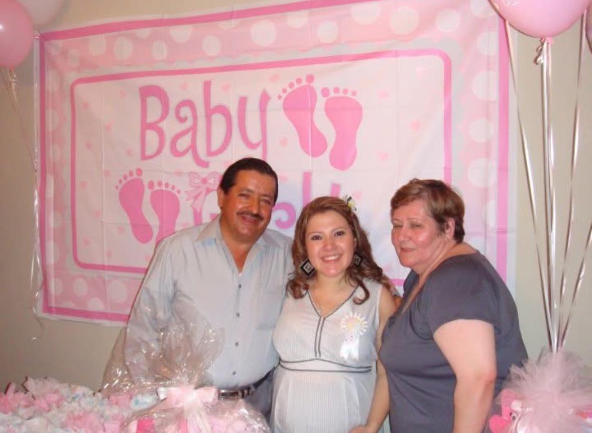 Guests gather together to celebrate a special baby shower with festive decorations and joy.