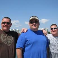 A group of men posing for a picture