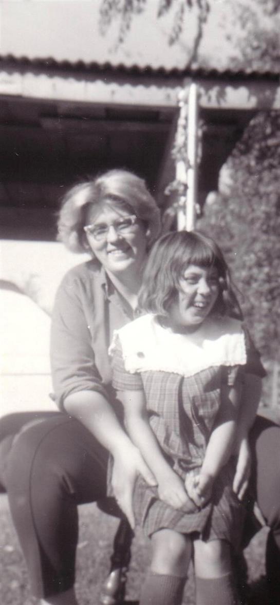 A woman and a child smiling