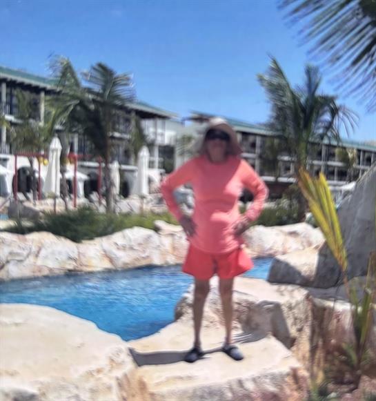 A woman standing on a rock