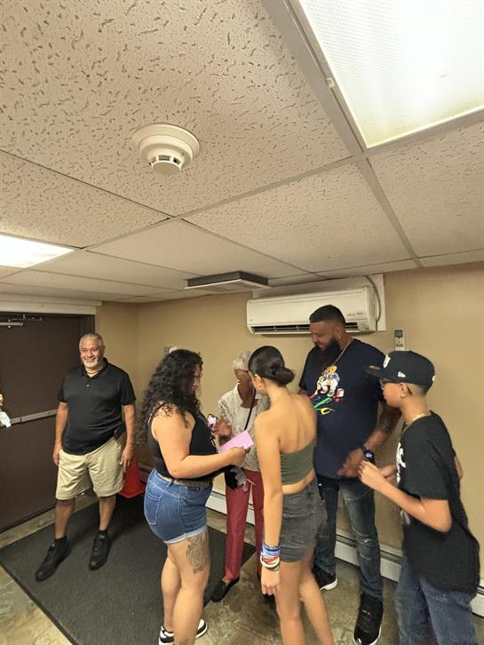 A group of people standing in a room