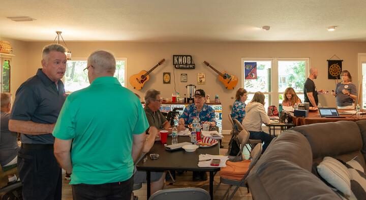 Friends engage in lively discussions while enjoying snacks and drinks in an inviting living space.