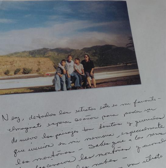 A family sitting on a ledge