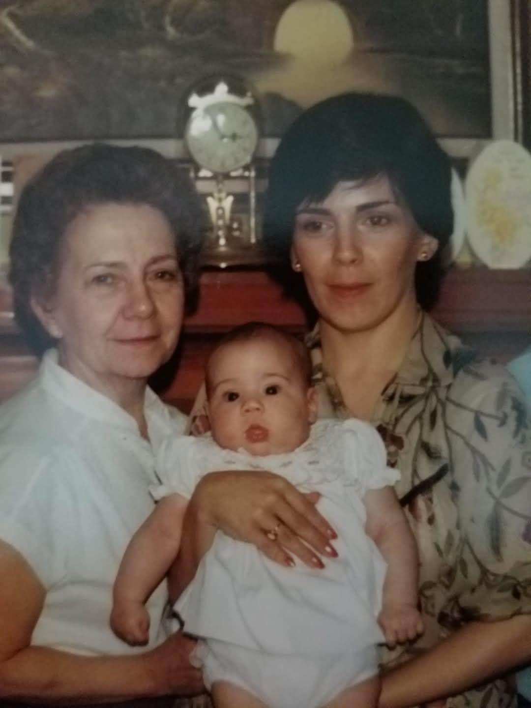 Three generations come together in a cozy setting, showcasing love and connection.