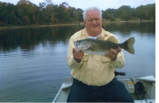 A man holding a fish in his hand