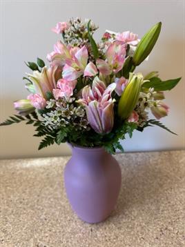 A vase with flowers in it