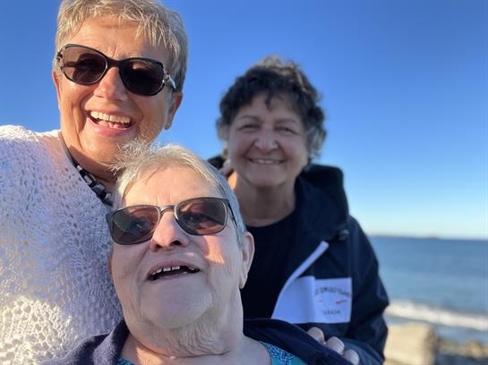 A group of women smiling at the camera