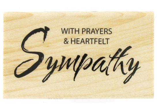 A wooden plaque with black text