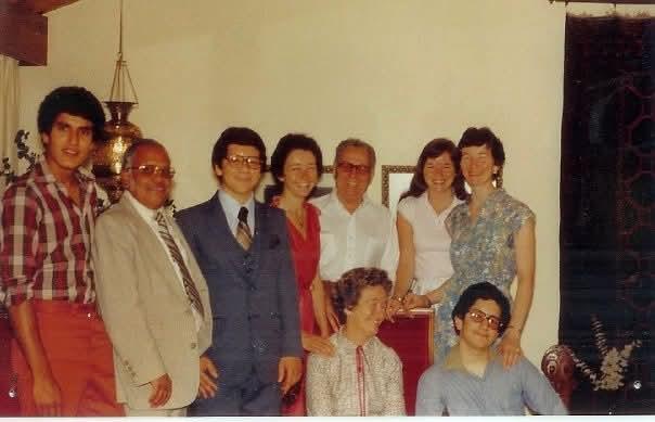 A warm family gathering in a cozy living room, showcasing laughter and vintage clothing.