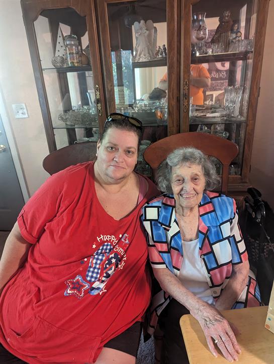 Two women sitting in a chair