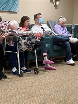 A group of people sitting in chairs