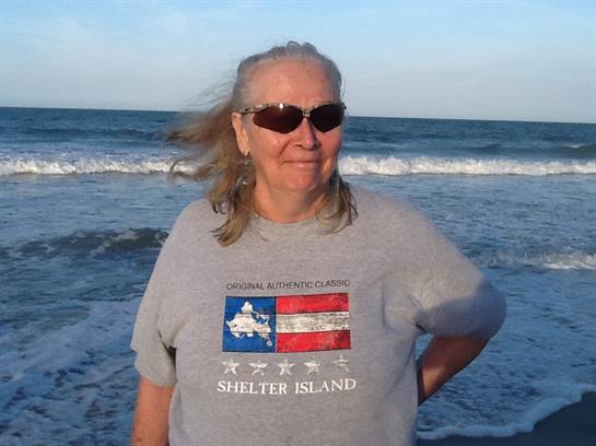 A woman standing on a beach
