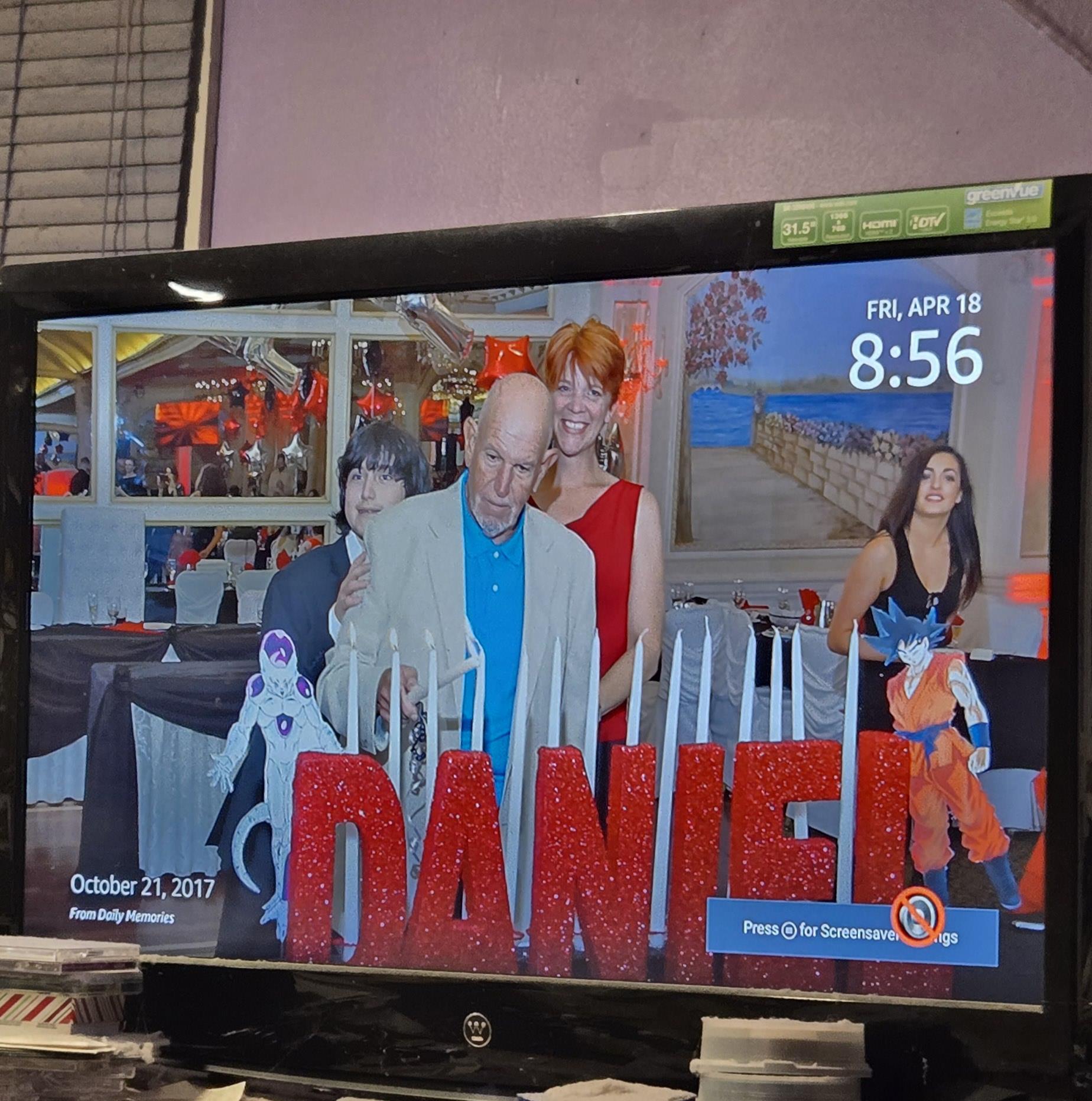 Loved ones gather around a festive display of Daniel's name for his birthday celebration.