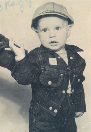 A baby wearing a hat and jacket