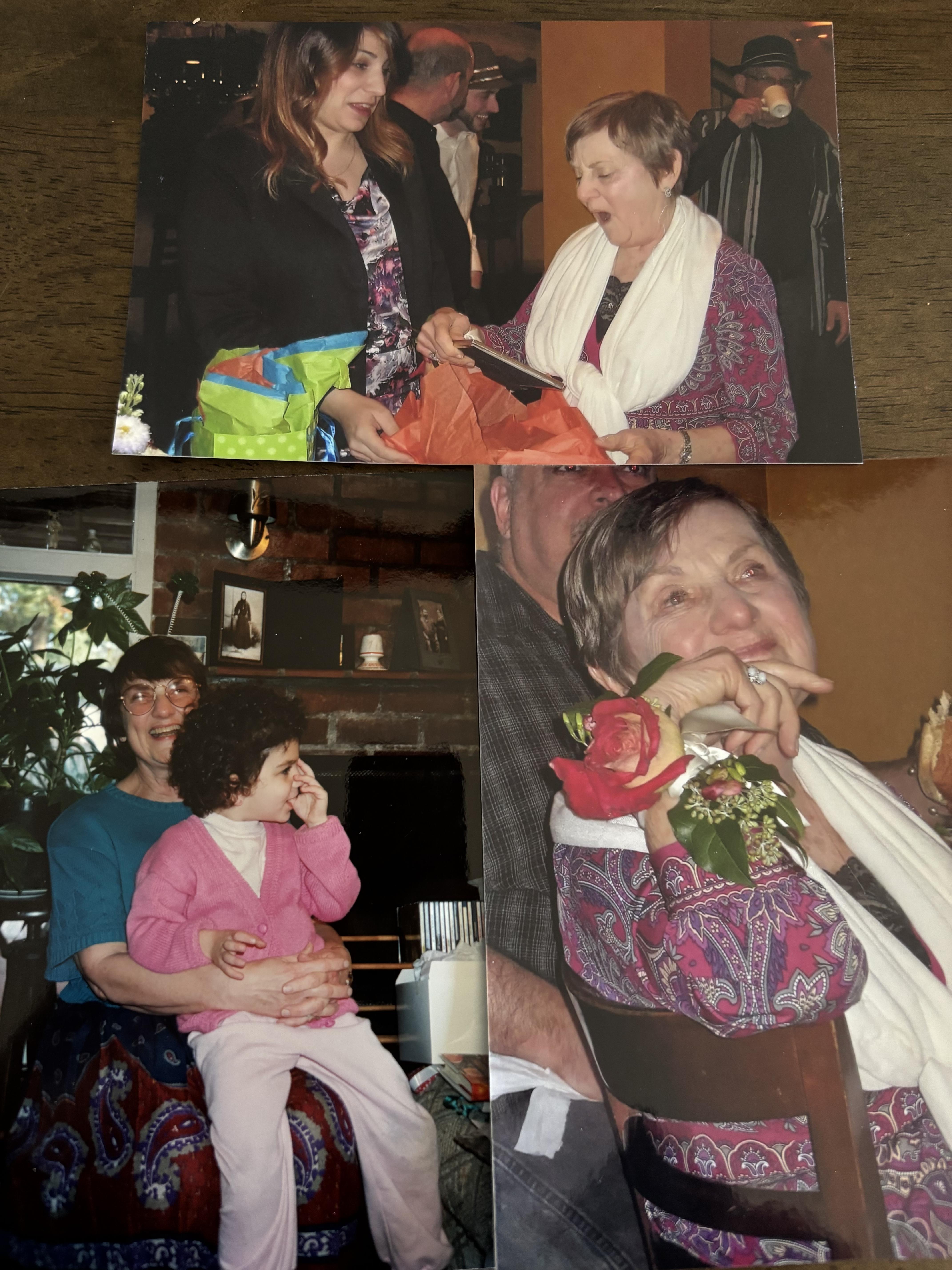 Family members share laughter and happiness during a gift exchange in a cozy indoor setting.