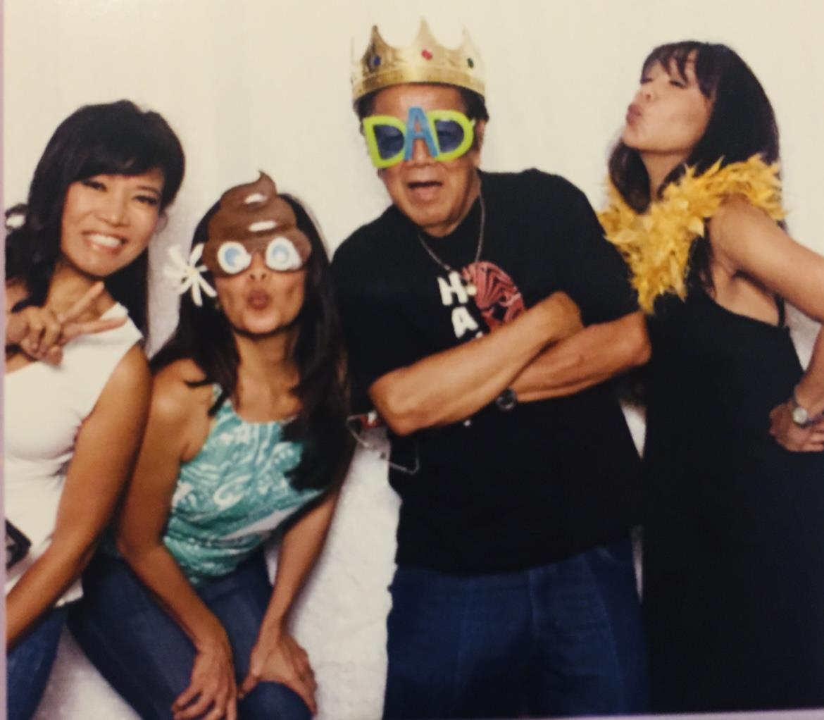 Friends celebrate with funny hats and props, making joyful memories at the party.