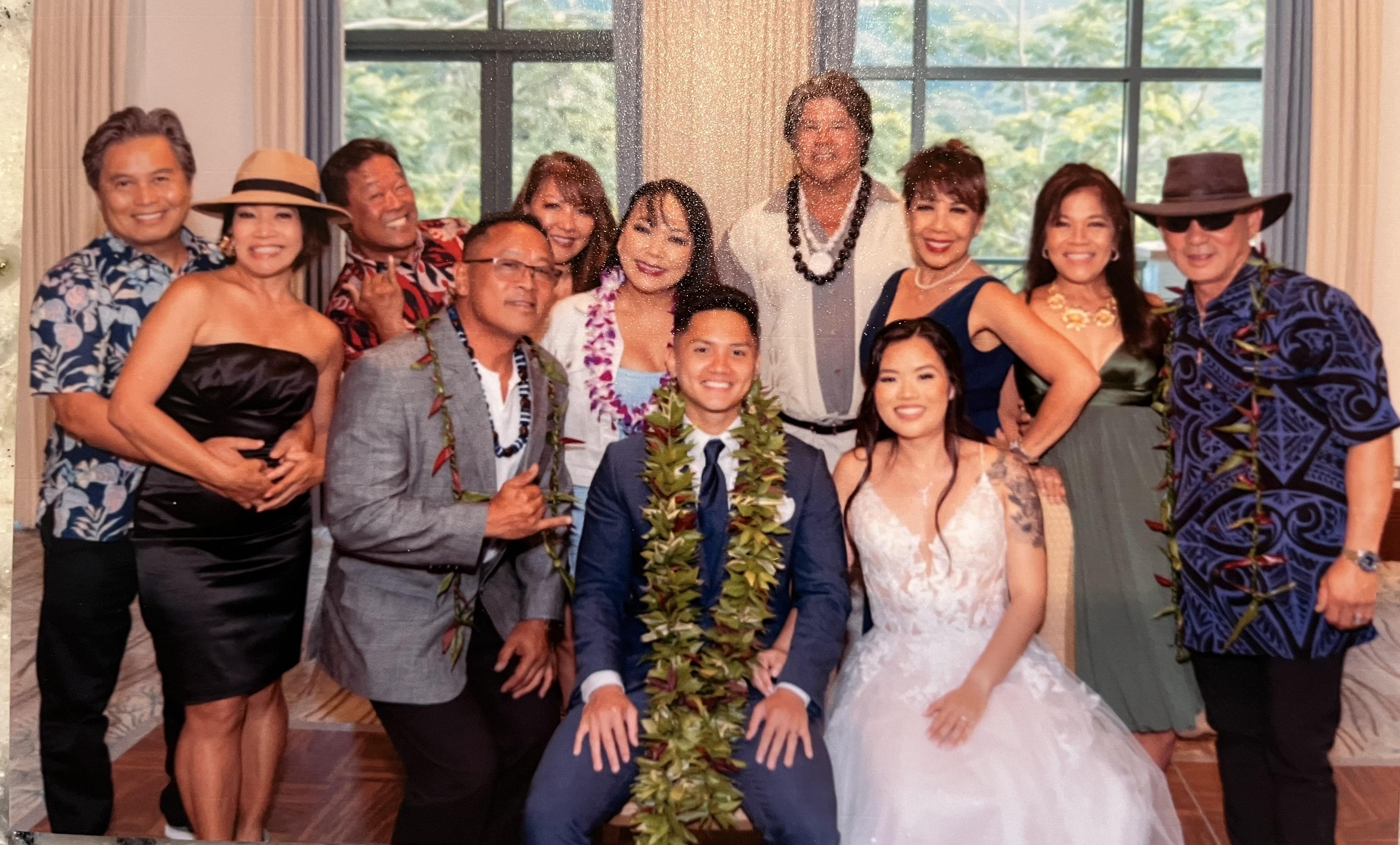 A joyful gathering of friends and family celebrating a wedding in an elegant venue.