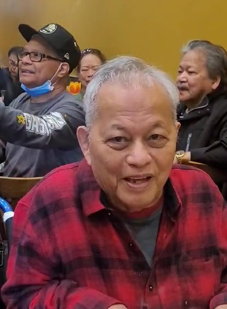 A group of seniors enjoys lively discussions and laughter at a community center during fall.