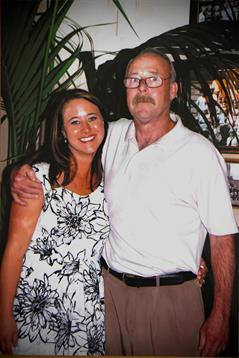 A man and woman posing for a picture