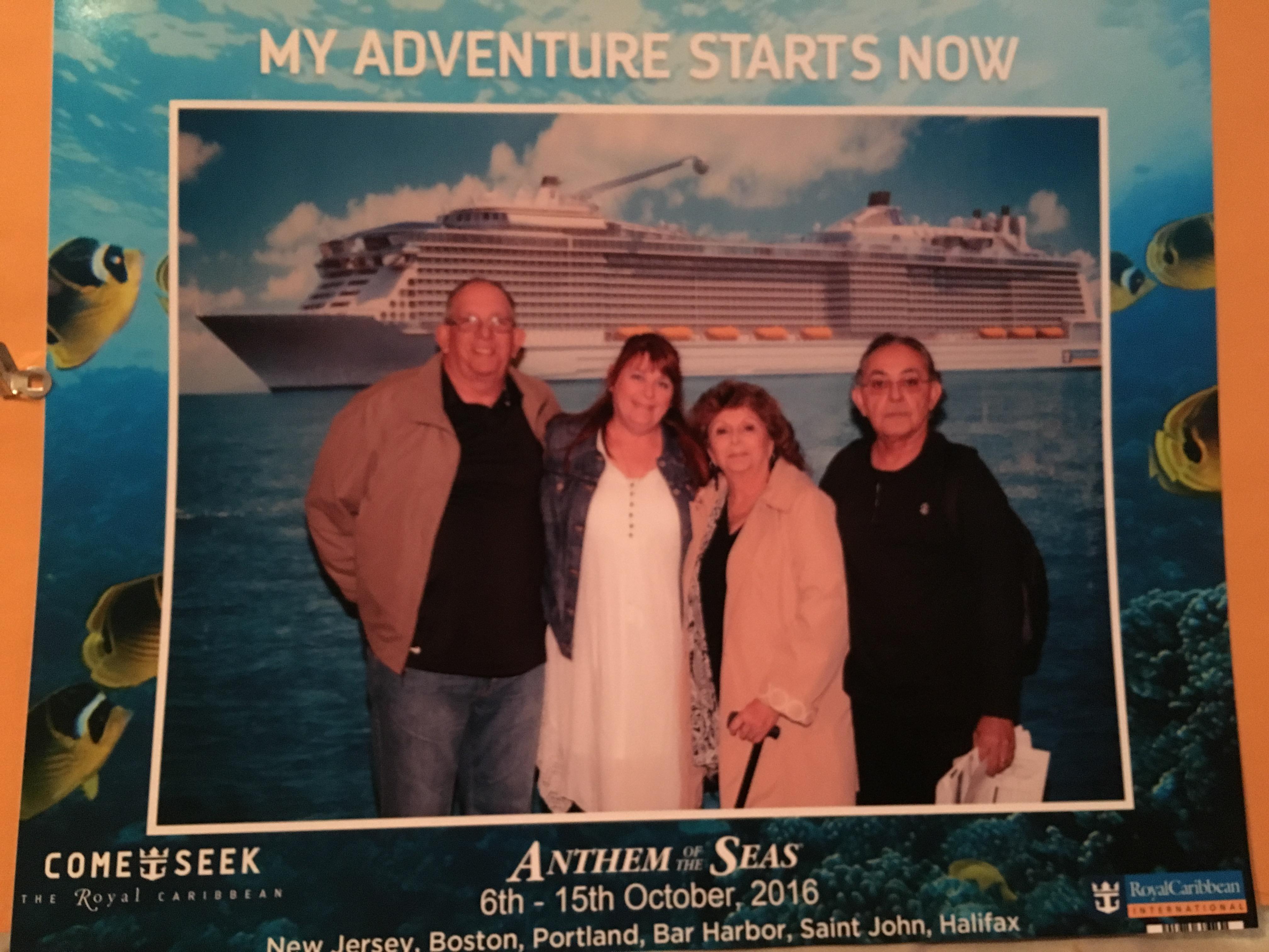 Friends pose together with a cruise ship in the background, celebrating their trip in October 2016.