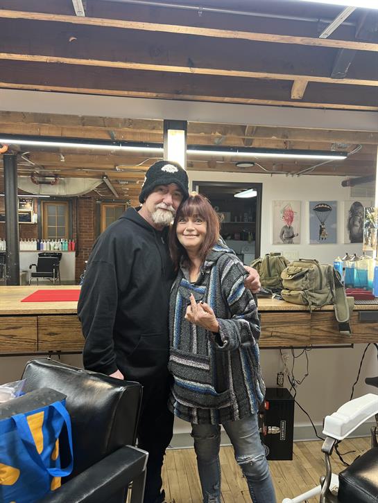 A man and woman posing for a picture