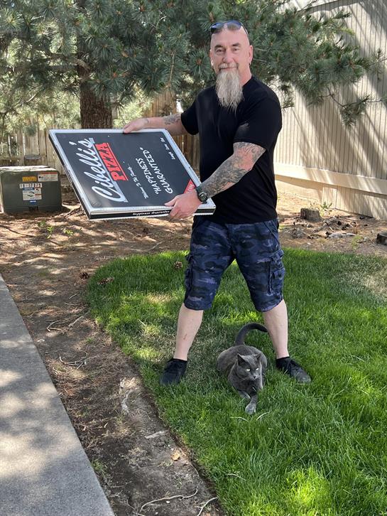 A man holding a sign