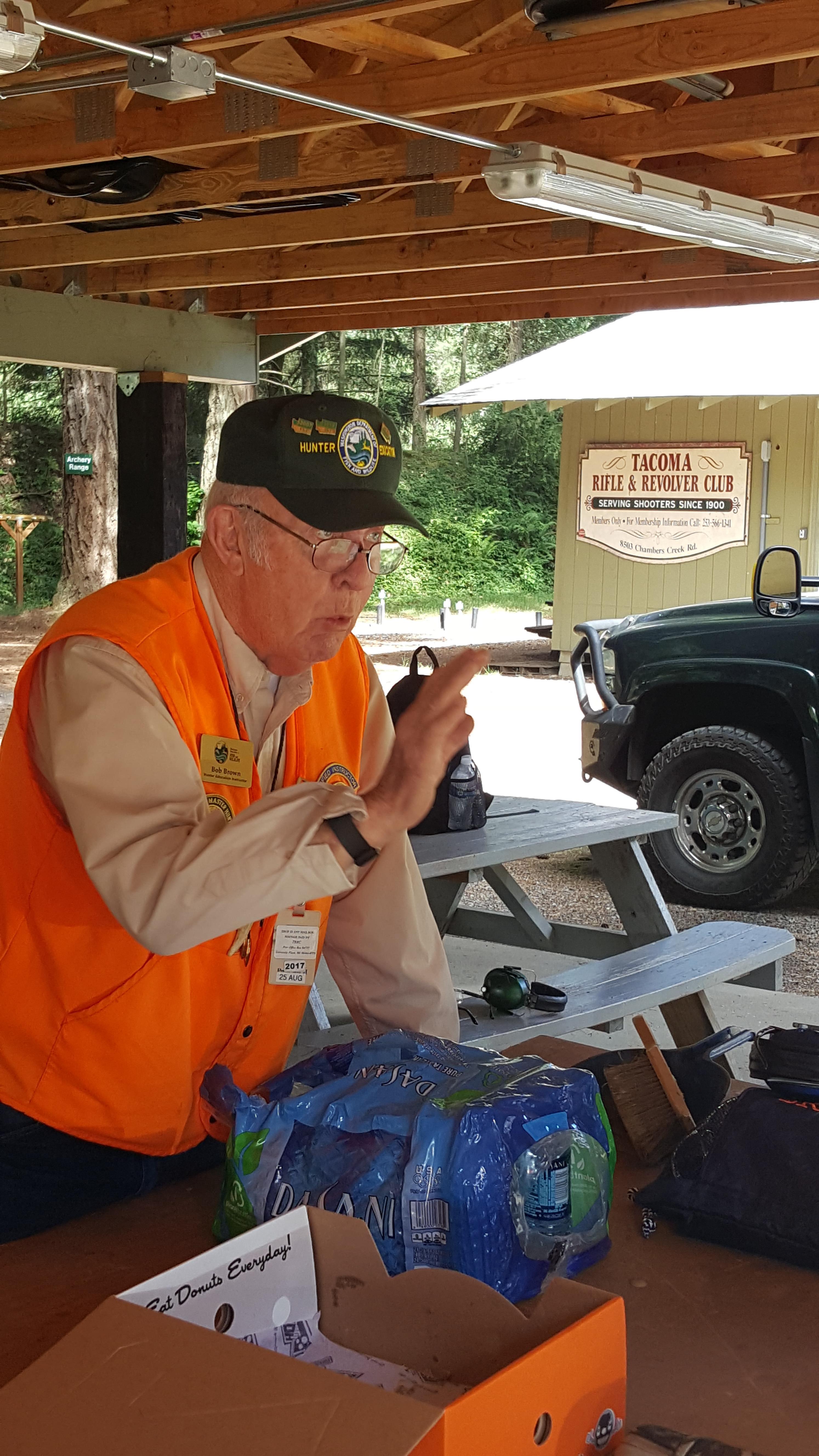 Instructor educates participants about firearm safety at the Tacoma Rifle and Revolver Club.