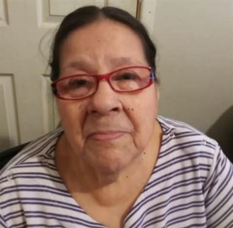 A woman wearing red glasses