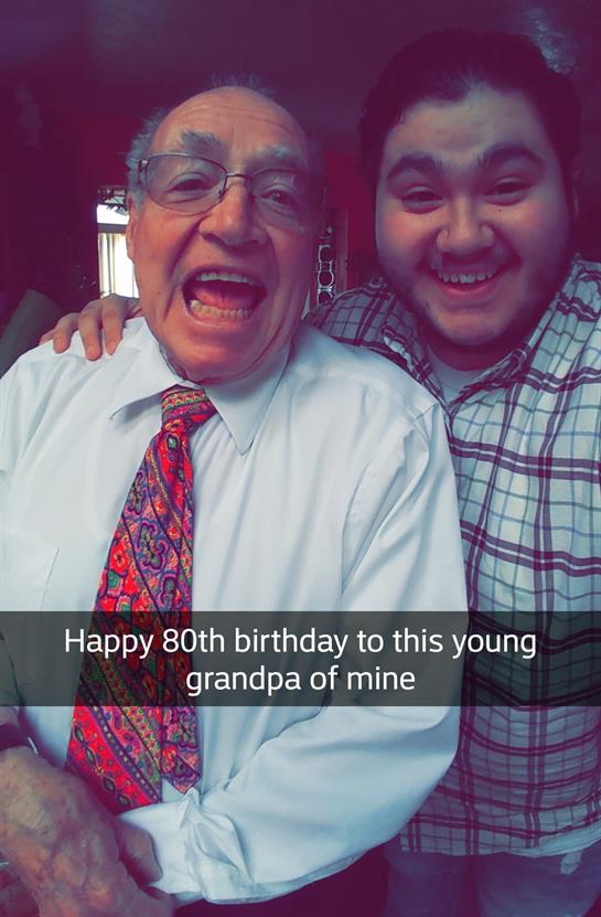 A man and boy smiling