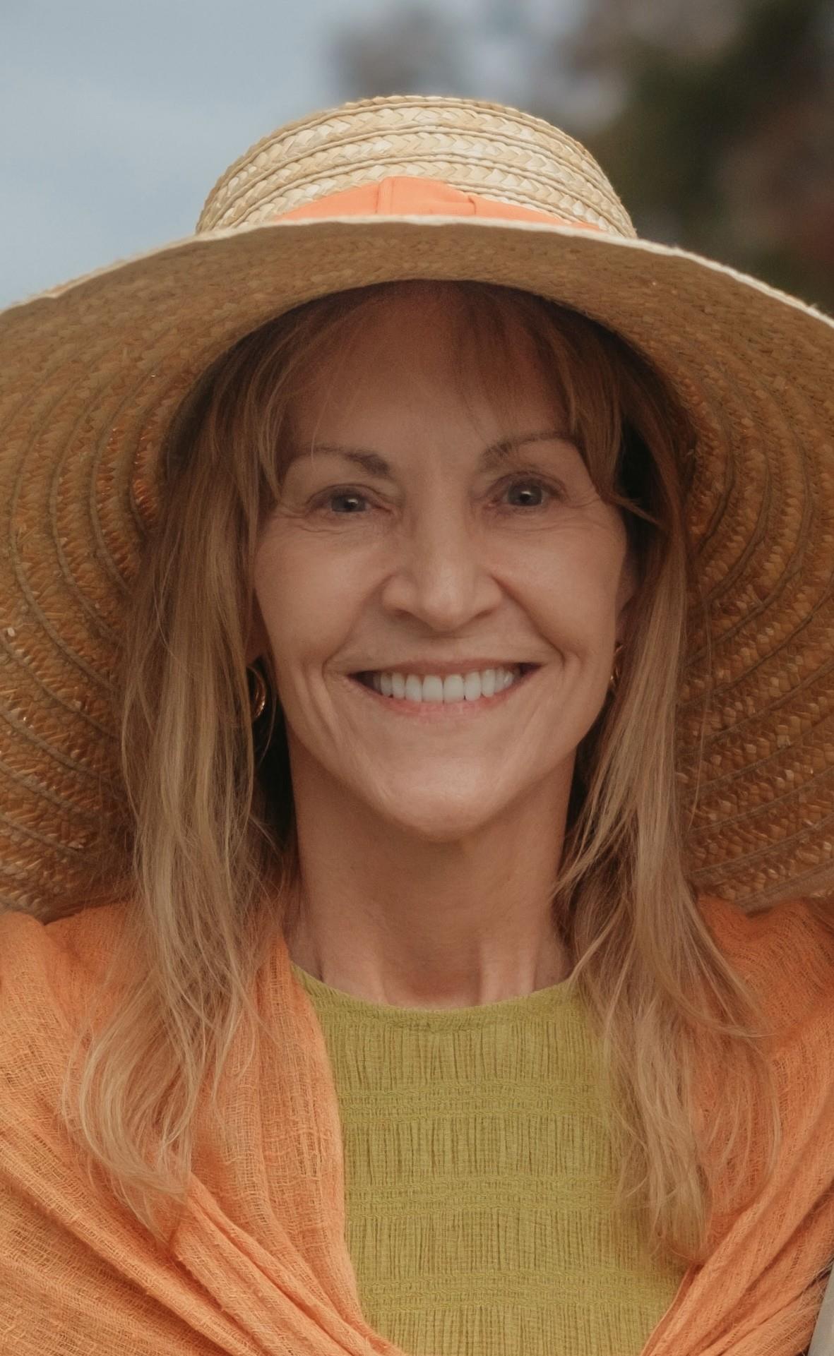 A woman wearing a large hat