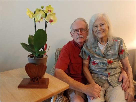 A man and woman sitting on a couch