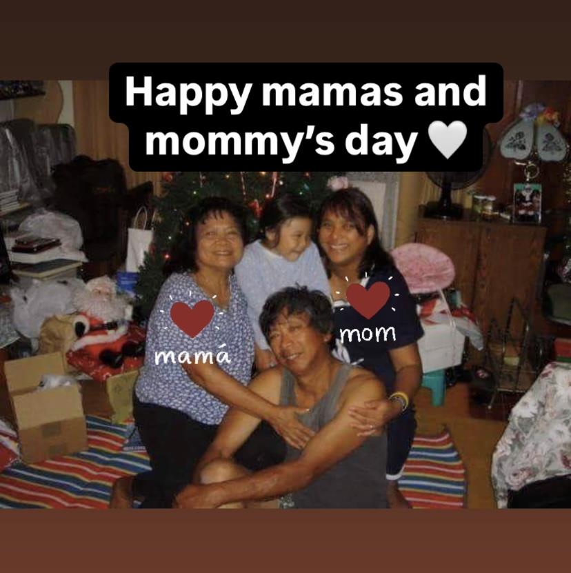 Family members gather in a cozy living room to celebrate Mother's Day with love and joy.