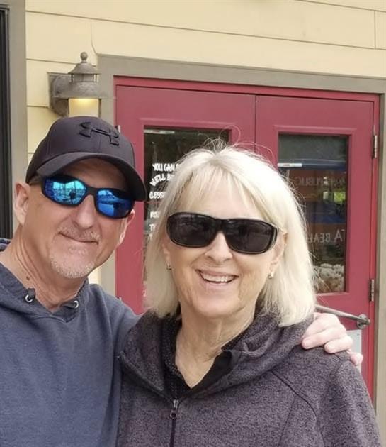 A man and woman wearing sunglasses