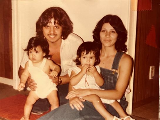 A man and woman with two babies