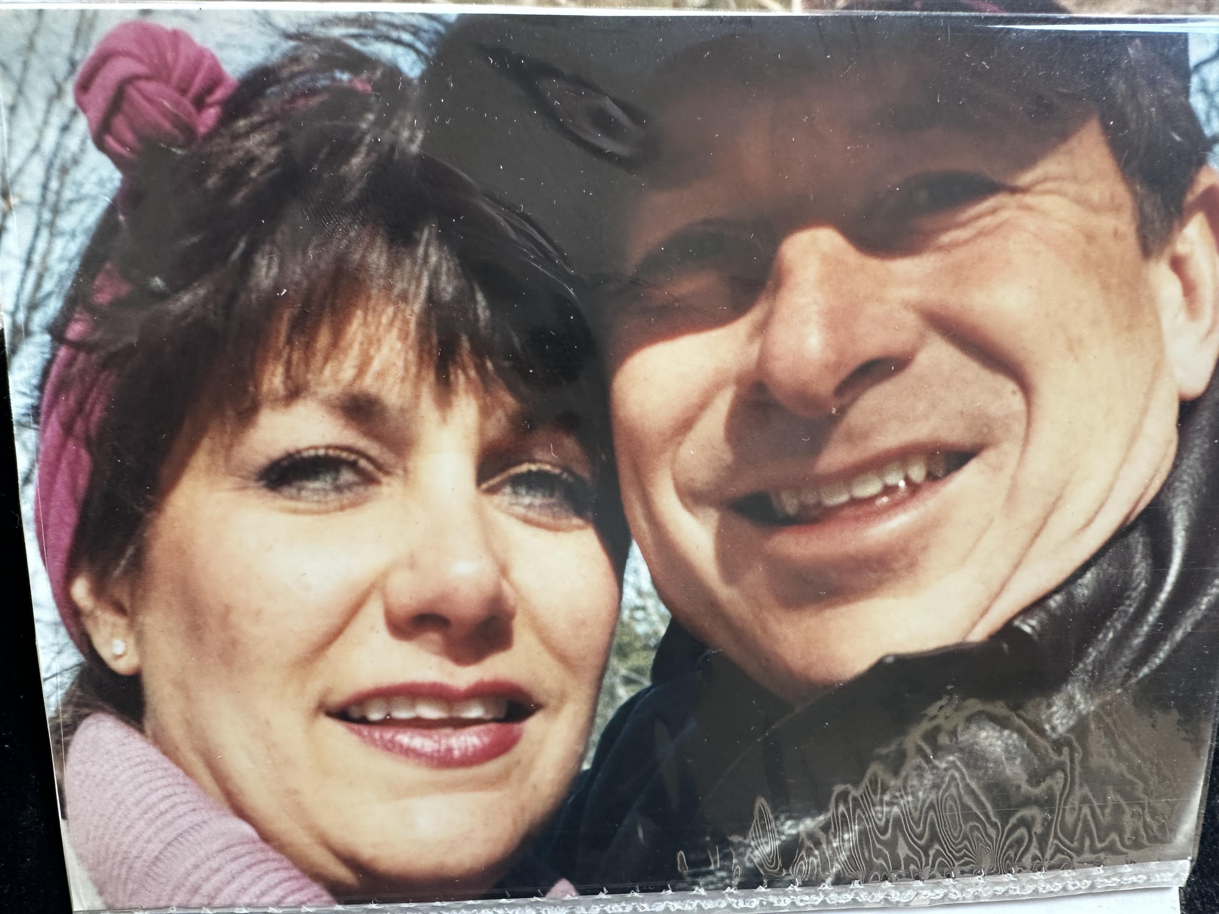 Two people share laughter and happiness, embracing the beautiful weather and each other’s company.