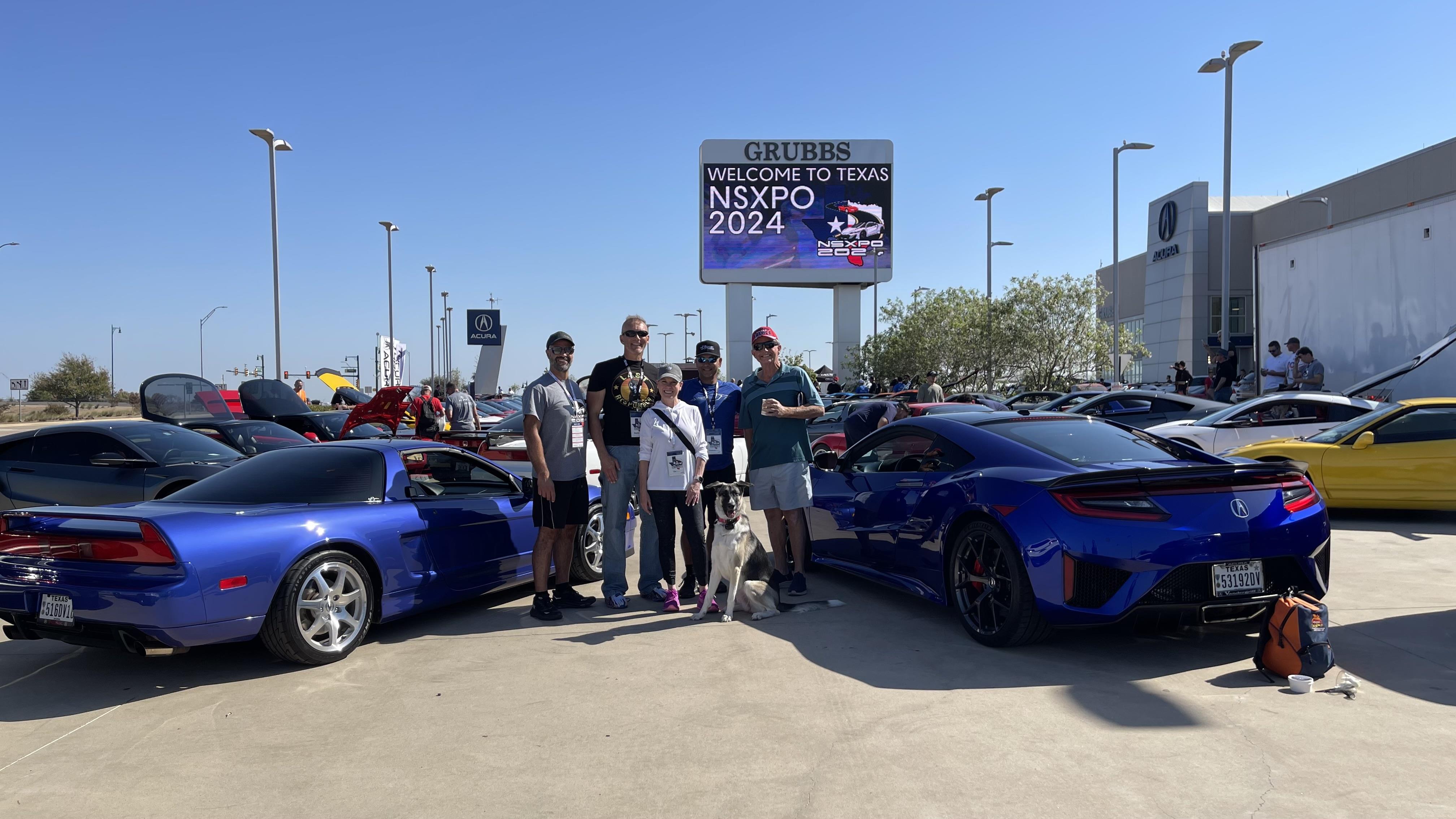 Enthusiasts celebrate at a car show in Texas, admiring luxury vehicles and enjoying the community.