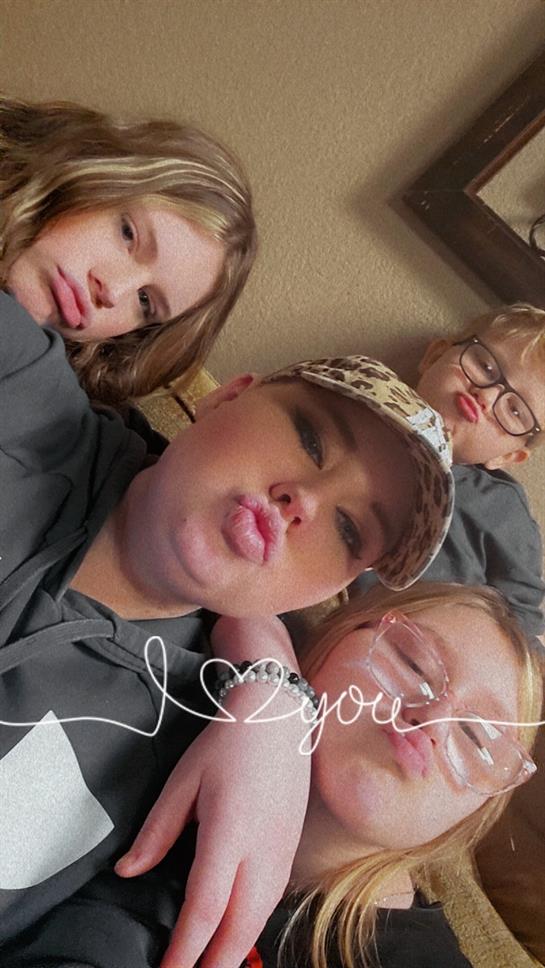 A group of people taking a selfie