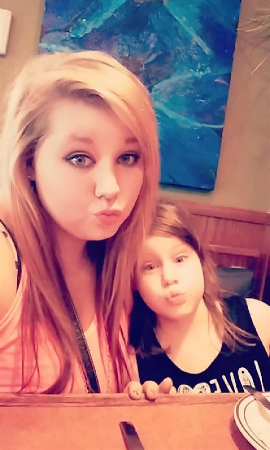 A girl and a girl making faces