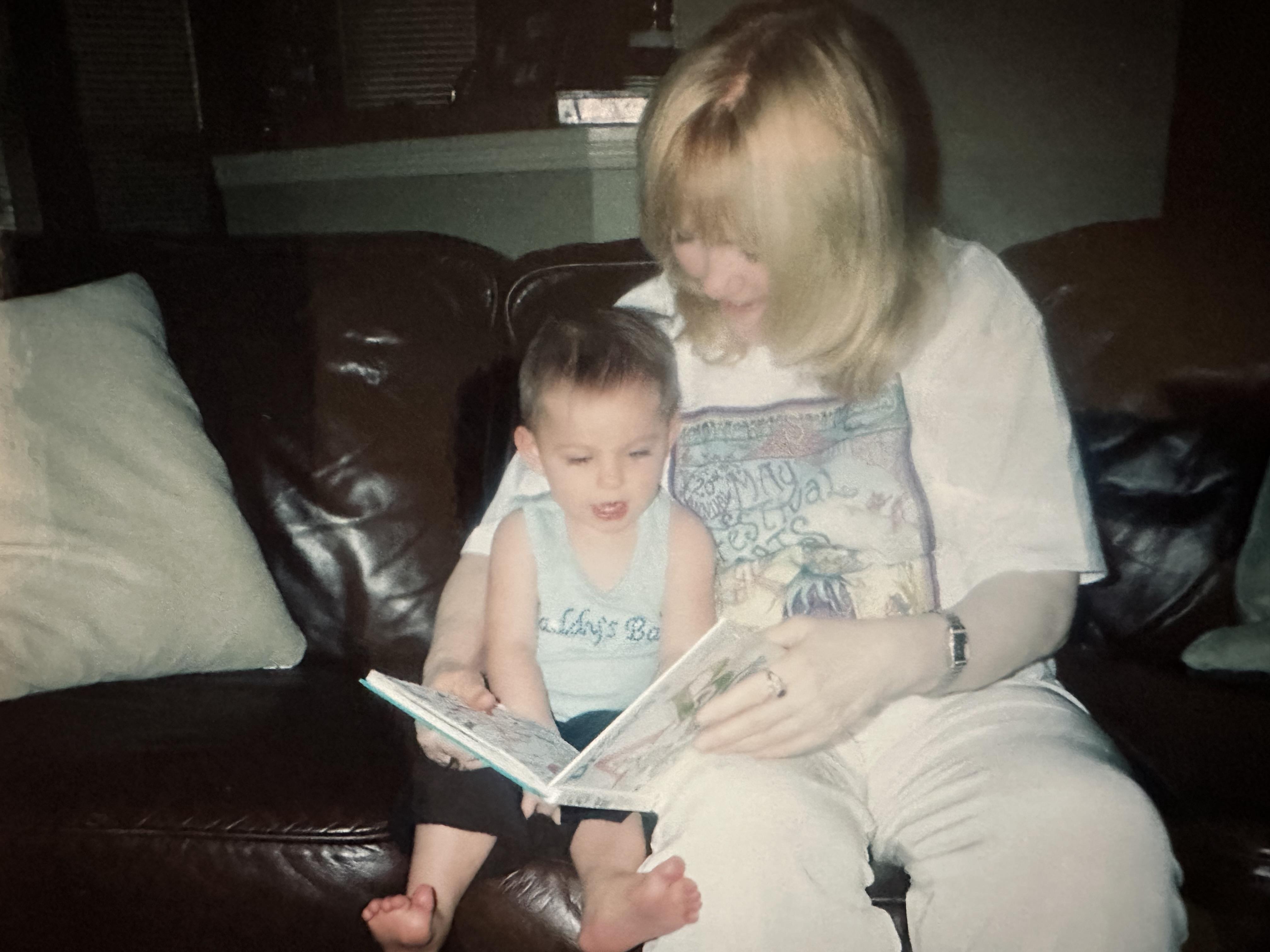 A woman and a child reading a book
