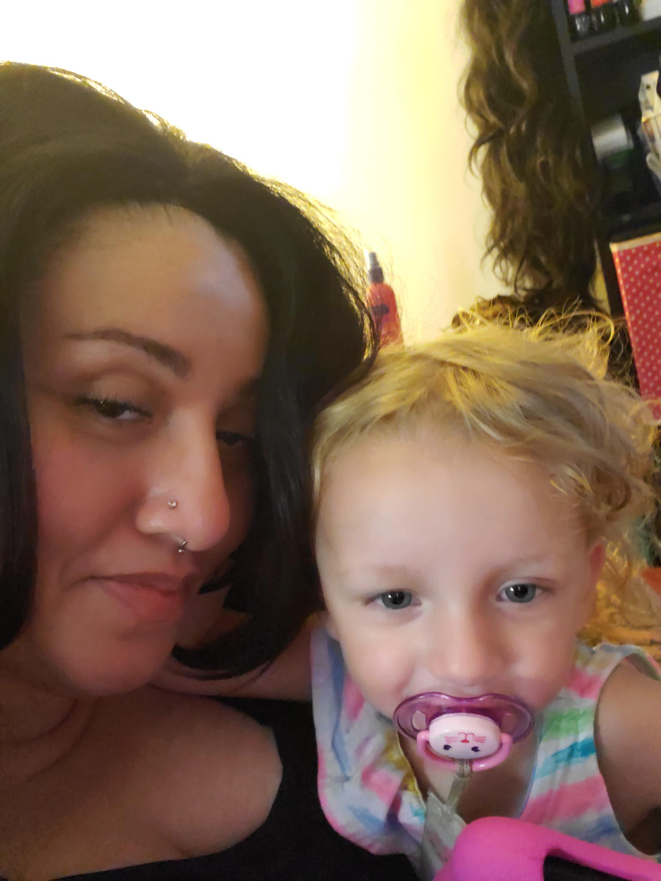 A woman and a child taking a selfie