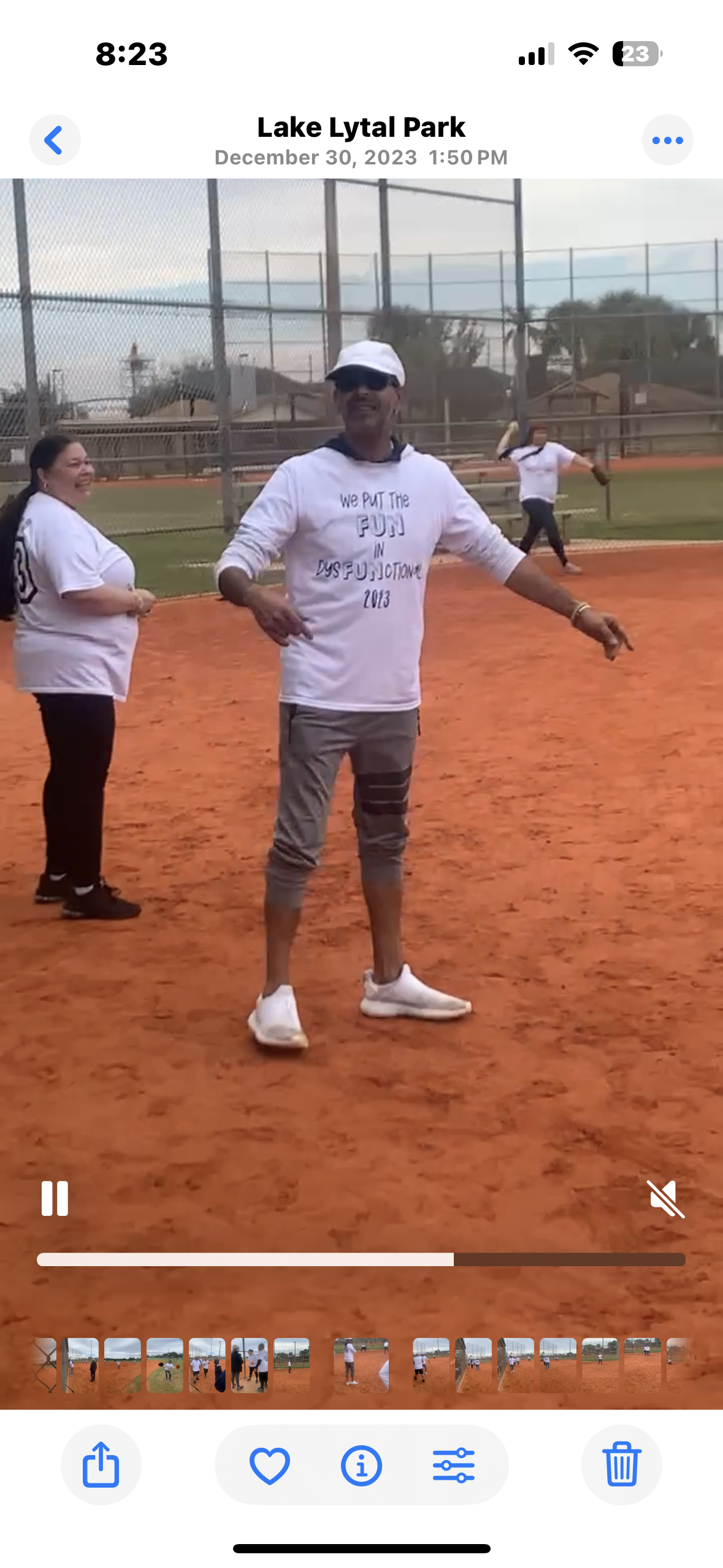 Participants engage in a friendly softball match at Lake Lytal Park, showcasing teamwork and fun.