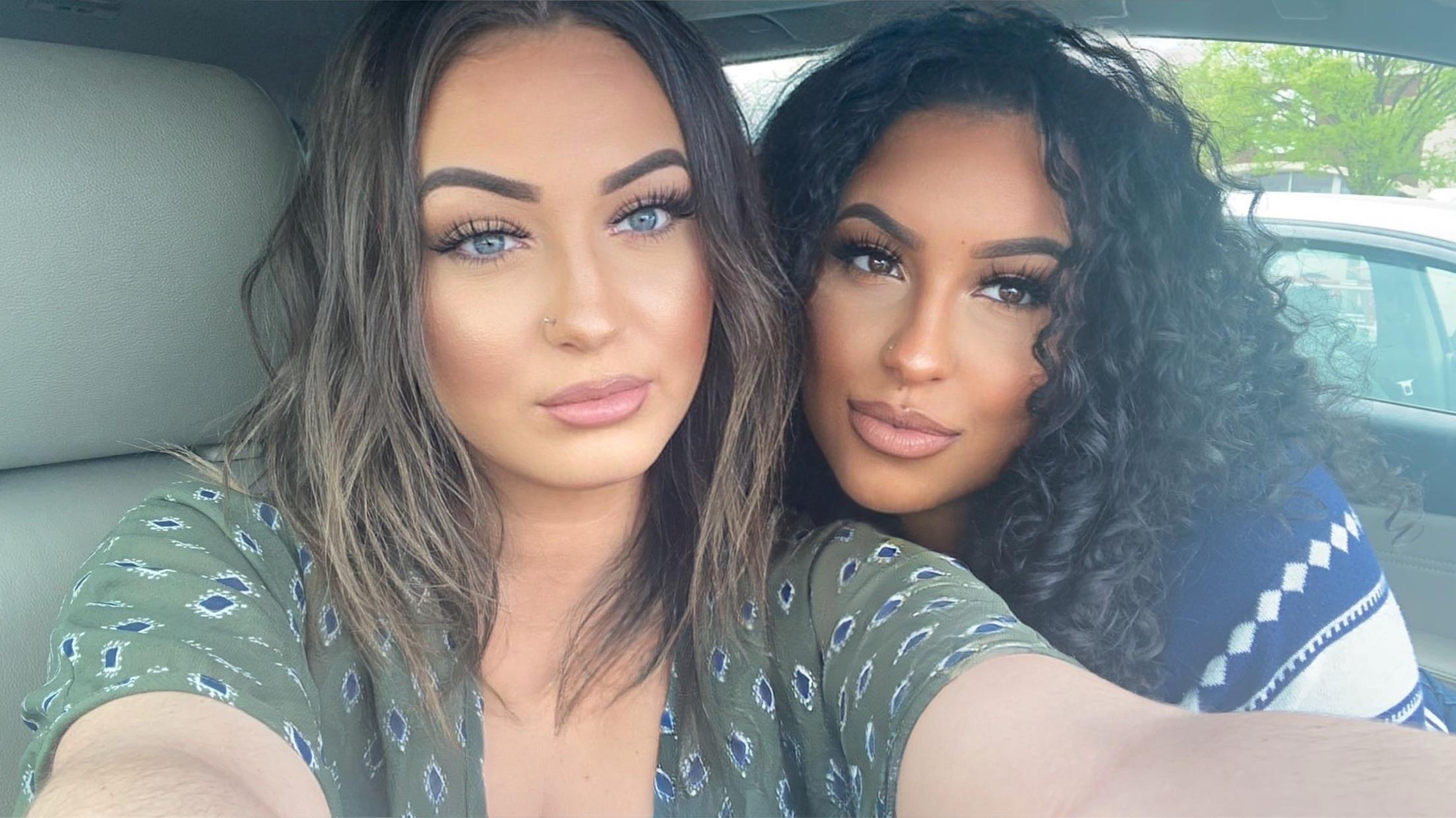 Friends are capturing a joyful moment in a car, smiling and enjoying the sunny day together.