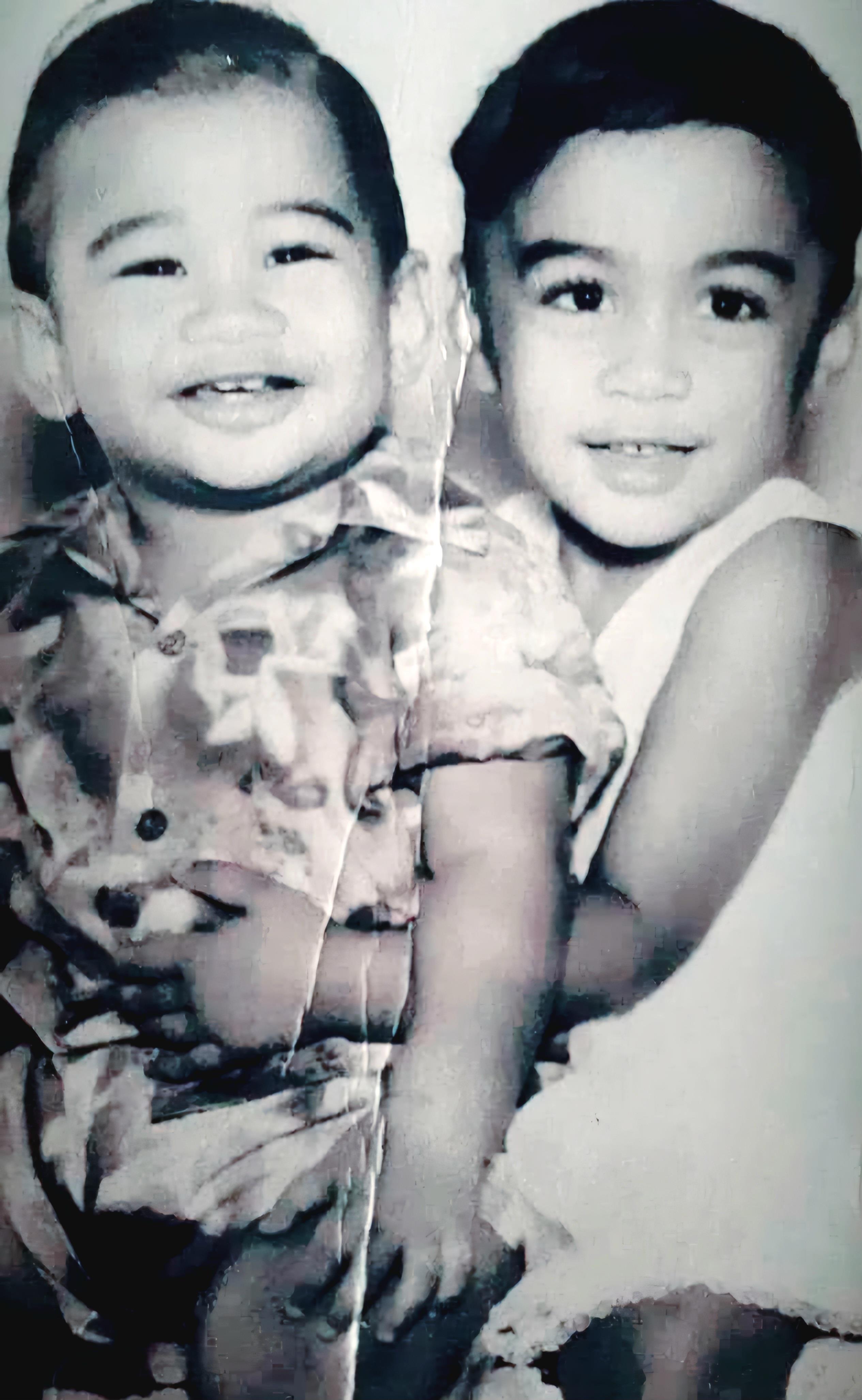 A black and white photo of two children