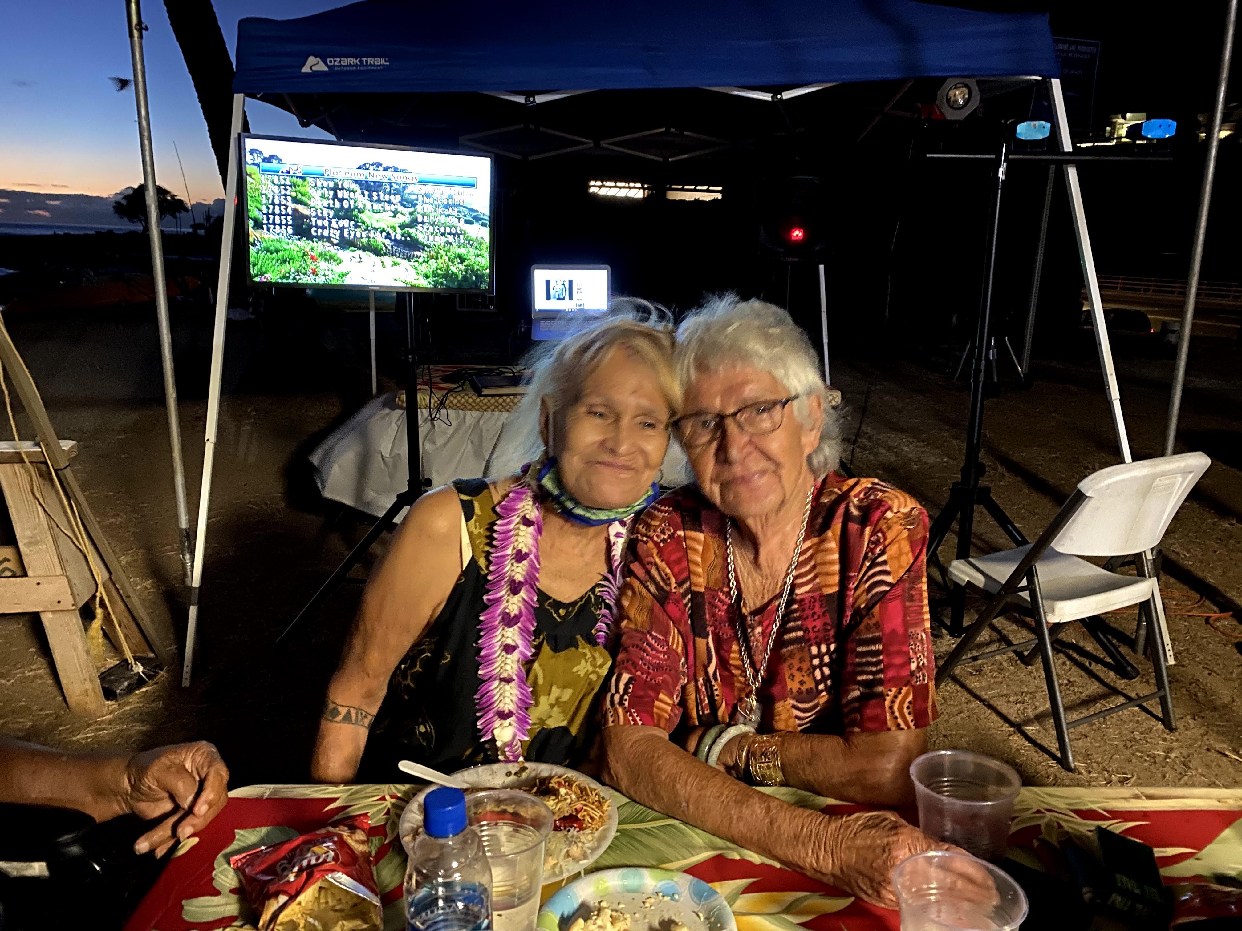 A couple of people sitting at a table