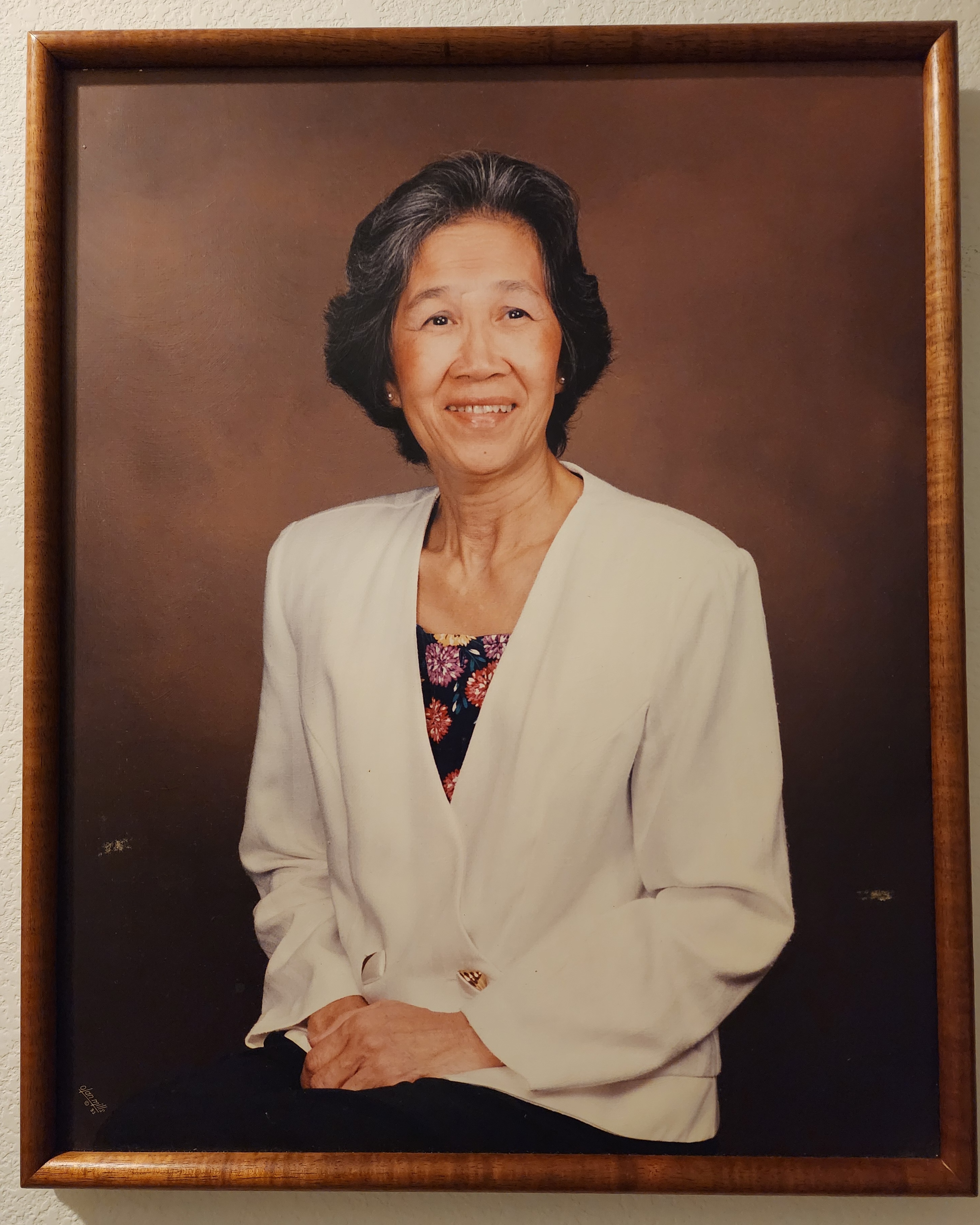 A portrait of a woman in a picture frame